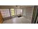 Bright sunroom with vertical blinds and multiple windows at 3935 Panola Ln # 183, Sarasota, FL 34232