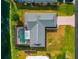 Aerial view of the home, showcasing the pool, backyard, and landscaping at 4423 Meadow Creek Cir, Sarasota, FL 34233