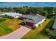Single story home with a pool and canal view in a residential neighborhood at 4423 Meadow Creek Cir, Sarasota, FL 34233