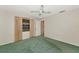 Bright bedroom with a ceiling fan, closet, neutral walls, and ample natural light at 4423 Meadow Creek Cir, Sarasota, FL 34233