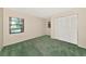 Cozy bedroom with neutral walls, a closet, and a window with a scenic view at 4423 Meadow Creek Cir, Sarasota, FL 34233