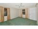 Comfortable bedroom with a ceiling fan and a window for natural lighting at 4423 Meadow Creek Cir, Sarasota, FL 34233