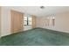 Bright living room with a large window and neutral walls provides a cozy atmosphere at 4423 Meadow Creek Cir, Sarasota, FL 34233