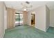 Living room featuring a sliding glass door with pool views at 4423 Meadow Creek Cir, Sarasota, FL 34233
