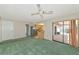A living room with views into the kitchen and backyard at 4423 Meadow Creek Cir, Sarasota, FL 34233