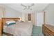 Main bedroom with king-size bed and wood furniture at 4423 Meadow Creek Cir, Sarasota, FL 34233