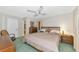 Spacious main bedroom with a king-size bed and dresser at 4423 Meadow Creek Cir, Sarasota, FL 34233