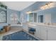 Bright bathroom featuring dual vanities, a soaking tub, and a separate shower at 4423 Via Del Villetti Dr, Venice, FL 34293