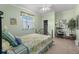 Bedroom with a full-size bed and light green walls at 4423 Via Del Villetti Dr, Venice, FL 34293