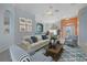 Bright living room with an open floor plan and view into dining room and entry at 4423 Via Del Villetti Dr, Venice, FL 34293