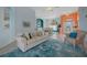 Open-concept living room with a view into dining room and entry hall, bright decor at 4423 Via Del Villetti Dr, Venice, FL 34293