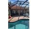 Inviting outdoor pool area with comfortable seating, perfect for relaxation and entertainment at 4423 Via Del Villetti Dr, Venice, FL 34293