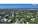 Aerial view showing home's location in a waterfront community with lush landscaping at 4815 Featherbed Ln, Siesta Key, FL 34242