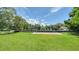 Private backyard with lush lawn and dock access at 4815 Featherbed Ln, Siesta Key, FL 34242