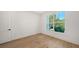 Bright bedroom with hardwood floors and large window at 4815 Featherbed Ln, Siesta Key, FL 34242