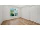 Well-lit bedroom with hardwood floors and closet at 4815 Featherbed Ln, Siesta Key, FL 34242