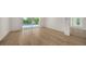 Bright bedroom featuring hardwood floors and pool view at 4815 Featherbed Ln, Siesta Key, FL 34242