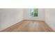 Spacious bedroom with hardwood floors and window at 4815 Featherbed Ln, Siesta Key, FL 34242