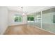 Elegant dining room featuring hardwood floors and patio access at 4815 Featherbed Ln, Siesta Key, FL 34242