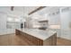 Gourmet kitchen with expansive island and high-end finishes at 4815 Featherbed Ln, Siesta Key, FL 34242