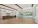 Open kitchen with island, hardwood floors, and access to pool area at 4815 Featherbed Ln, Siesta Key, FL 34242