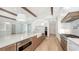 Bright kitchen boasts stainless steel appliances and an eat-in island at 4815 Featherbed Ln, Siesta Key, FL 34242
