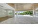 Spacious covered patio with pool and outdoor kitchen at 4815 Featherbed Ln, Siesta Key, FL 34242