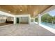 Relaxing pool area with covered patio and open views at 4815 Featherbed Ln, Siesta Key, FL 34242