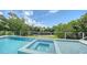 Backyard pool and jacuzzi with waterfront views at 4815 Featherbed Ln, Siesta Key, FL 34242