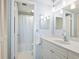 Clean bathroom featuring white cabinets, vanity, and a shower with tub at 4822 Ocean Blvd # 8B, Sarasota, FL 34242