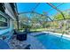 Refreshing screened pool with patio seating and backyard view at 5003 86Th Street W Ct, Bradenton, FL 34210