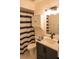 Clean bathroom with navy blue and white striped shower curtain at 5311 Creek Dr, Sarasota, FL 34231
