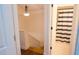 Bathroom with staircase and striped shower curtain at 5311 Creek Dr, Sarasota, FL 34231