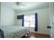 Bright bedroom with a bed, window, and TV at 5311 Creek Dr, Sarasota, FL 34231