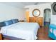 Main bedroom with large bed, dresser, and teal side table at 5311 Creek Dr, Sarasota, FL 34231