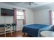 Bedroom with a bed, desk, window, and TV at 5311 Creek Dr, Sarasota, FL 34231