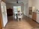 Dining room with wood table, white chairs, and view of the pool at 5311 Creek Dr, Sarasota, FL 34231