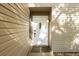 White front door with sidelights and light brown siding at 5311 Creek Dr, Sarasota, FL 34231