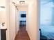 Hallway with barn door, view of bedroom and a home office at 5311 Creek Dr, Sarasota, FL 34231
