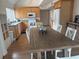 Bright kitchen features wood cabinets, granite countertops, and a spacious dining area at 5311 Creek Dr, Sarasota, FL 34231