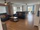 Living room with foosball table, couches, and wood floors at 5311 Creek Dr, Sarasota, FL 34231