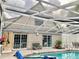 Relaxing screened-in pool area with patio furniture at 5311 Creek Dr, Sarasota, FL 34231