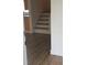 Wooden staircase with light brown flooring at 5311 Creek Dr, Sarasota, FL 34231