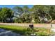 House with wood fence, mailbox, and landscaping at 5311 Creek Dr, Sarasota, FL 34231