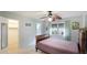 Cozy bedroom with a double bed, ceiling fan, and walk-in closet at 5474 Riverbluff Cir # V35, Sarasota, FL 34231