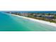 Aerial view of beach and condo buildings at 575 Sanctuary Dr # A303, Longboat Key, FL 34228