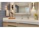 Elegant bathroom featuring modern fixtures, stylish lighting, and coastal-themed decor for a spa-like feel at 575 Sanctuary Dr # A303, Longboat Key, FL 34228