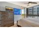 Bedroom with water views and ample dresser space at 575 Sanctuary Dr # A303, Longboat Key, FL 34228