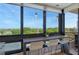 Bright kitchen with breakfast bar offering panoramic views and modern pendant lighting at 575 Sanctuary Dr # A303, Longboat Key, FL 34228