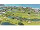 Aerial view of lush golf course and resort at 575 Sanctuary Dr # A303, Longboat Key, FL 34228